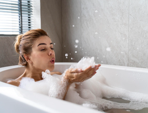 woman-enjoying-relaxing-bubble-bath_23-2149122079